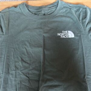 Green north face shirt
